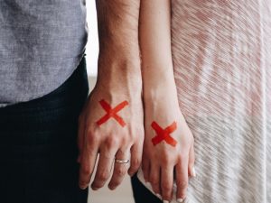 Dunedin Divorce Counseling Canva Two Hands with Mark X 300x225
